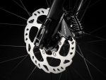 Close-up of a Trek Checkpoint ALR 5 - Crossbar 54" disc brake rotor and calliper on black.