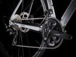 Close-up of Trek Émonda ALR 5 drivetrain: gears, chain, chainset, and derailleur shown.