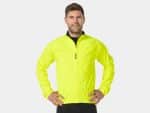 Man wears Bontrager Circuit Cycling Rain Jacket Extra Small, hands on hips, plain background.