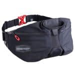 A black waist pack with a red buckle, multiple compartments, and a small, gray hexagonal patterned section. The front has a reflective label with the text "BONTRAGER" and a zipper pouch. The Bontrager Rapid Pack appears to be durable and suitable for outdoor activities.