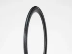 A single Tyre Bontrager AW1 Hard-Case Lite 700x25c stands upright on a white background.
