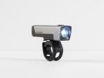 A Bontrager Ion Comp R Front Bike Light, silver and black, on and mounted on a bracket.