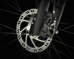 Close-up of a Dual Sport 1 Gen 4 disc brake and calliper on a wheel, against a black background.