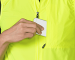 A person puts a Clifden Bike Hire card into the chest pocket of a Bontrager Circuit Wind Gilet.