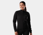 Woman in a Trek Circuit Women's Softshell Cycling Jacket, smiling before her Clifden Bike Hire.