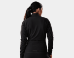 Woman with dark ponytail wearing Trek Circuit Women's Softshell Jacket, back view at Clifden Bike Hire.