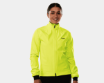 Woman in Trek Circuit Women's Rain Cycling Jacket, smiling by Clifden Bike Hire, white background.