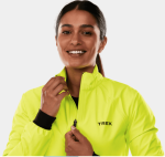 Woman smiling in a Trek Circuit Women's Rain Cycling Jacket, zipping up the front.