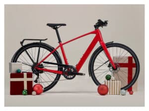 A Clifden Bike Hire red bicycle surrounded by gift boxes and Christmas baubles.